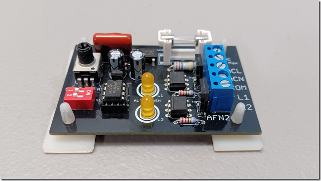 AFN2 Electronic circuit board with various components on a gray background